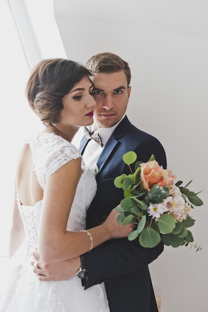 Studio portrait of newlyweds in a beautiful festive costumes 6488