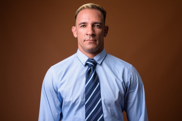 Studio shot of businessman on brown