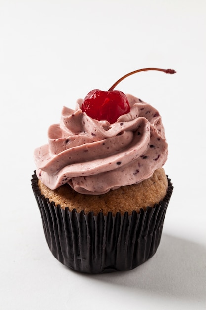 Studio shot of a cupcake, on a white background.