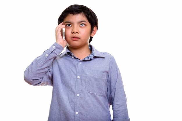 Studio shot of Japanese boy isolated against white background