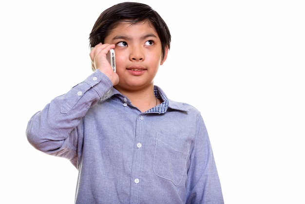 Studio shot of Japanese boy isolated against white background