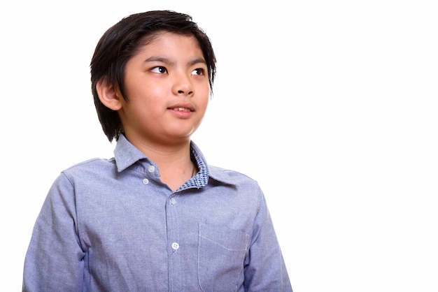 Studio shot of Japanese boy isolated against white background