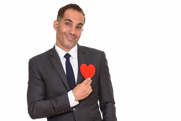 Studio shot of mature handsome Persian businessman in suit isolated against white background