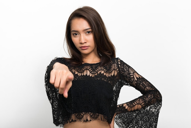 Studio shot of young beautiful Asian woman