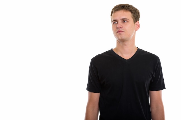 Studio shot of young man isolated against white background