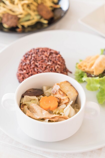 Stuffed cabbage soup with berry rice and tofu