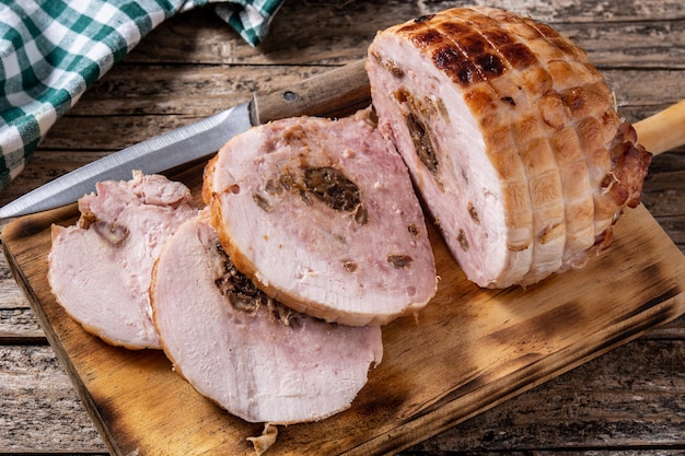 Stuffed chicken with nuts on a rustic wooden table