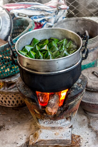 Stuffed Dough Pyramid Thai Dessert on the steamer stove, called Ka-Nhom-Tian