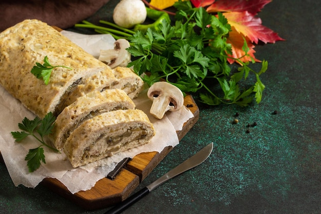 Stuffed meatloaf with mushrooms and cheese on the Thanksgiving holiday table Copy space