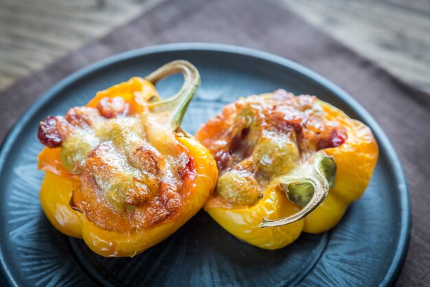 Stuffed peppers with sausages and mozzarella topping