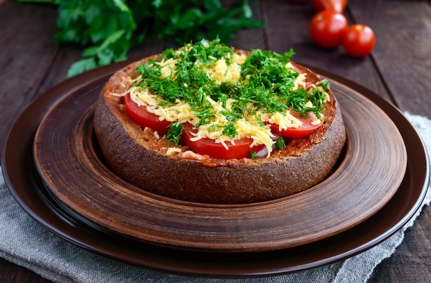 Stuffed rye bread with tomatoes and cheese