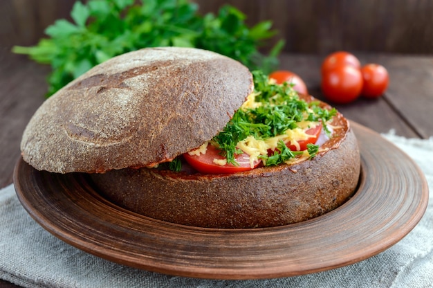 Stuffed rye bread with tomatoes and cheese