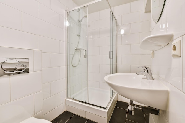 Stunning bathroom with black tiled floor and white walls