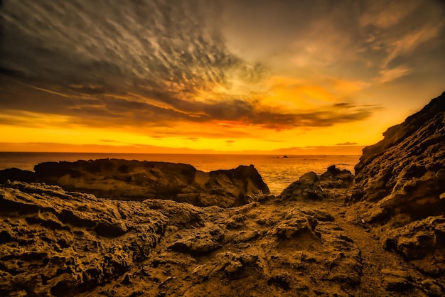 Stunning orange sunset at Cape Palliser