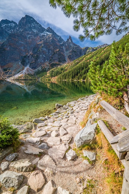 Stunning pond in the mountains at sunrise in autumn