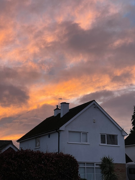 Stunning sunrise sky above cottage house