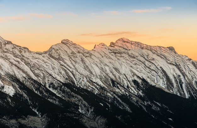 Stunning sunset of snow capped Canadian Rocky mountains at Banff National Park in Alberta, Canada 