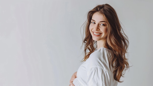 Stunning Young Pregnant Woman Standing Near White Wall