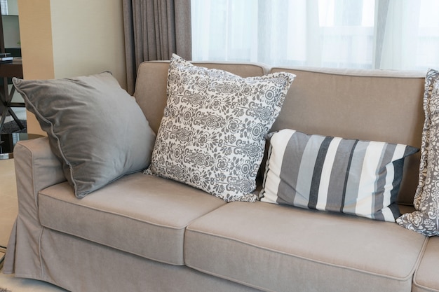 Sturdy brown tweed sofa with grey patterned pillows