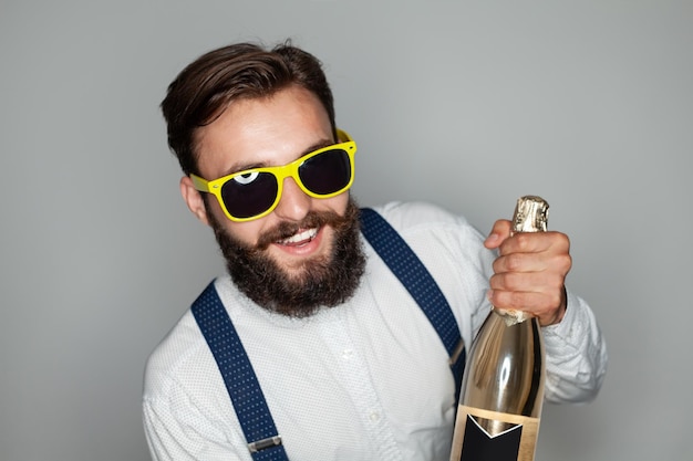 Stylish bearded man with champagne