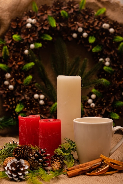 Stylish beautiful New Years composition of cones spruce and candles