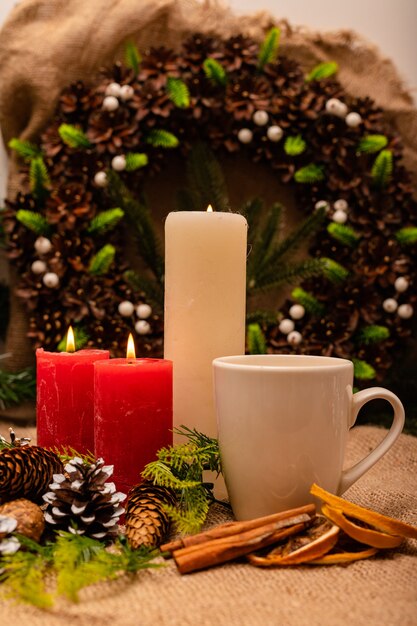 Stylish beautiful New Years composition of cones spruce and candles