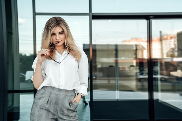 Stylish business woman posing outside