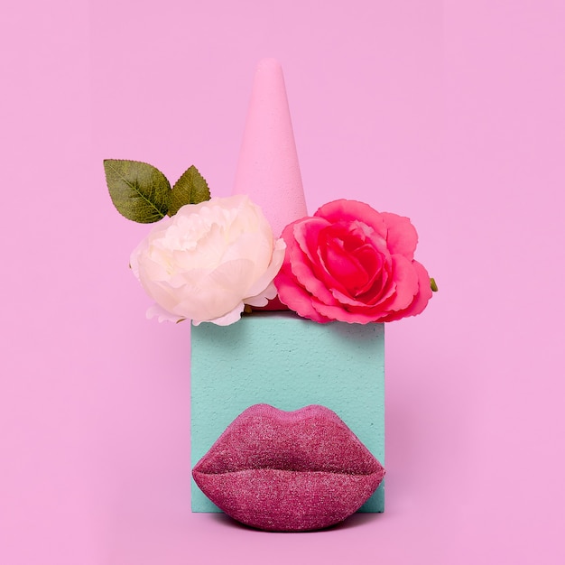 Stylish composition of flowers and lips. Beauty, aroma, make-up concept