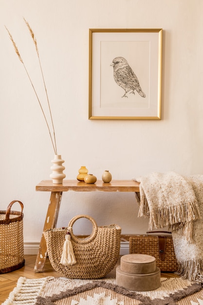 Stylish composition of living room interior with frame, wooden bench, pillow, plaid, woman bag, books, cacti, macrame, plant, decortaion and elegant personal accessories in modern home decor.