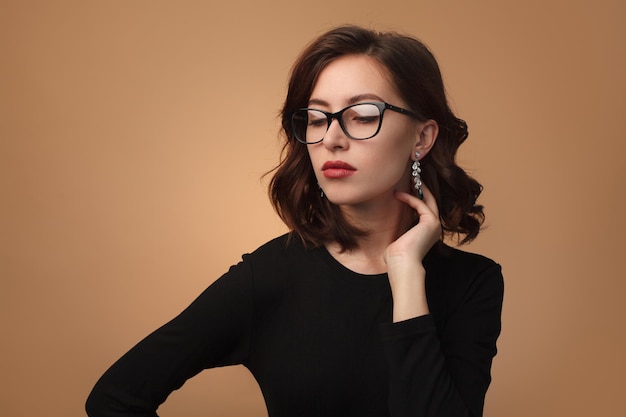 Stylish confident model in eyeglasses