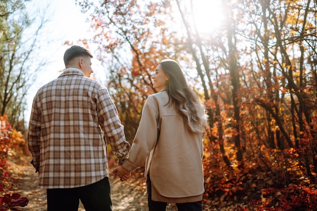 Stylish couple walking and enjoying autumn weather People relaxation and vacations concept