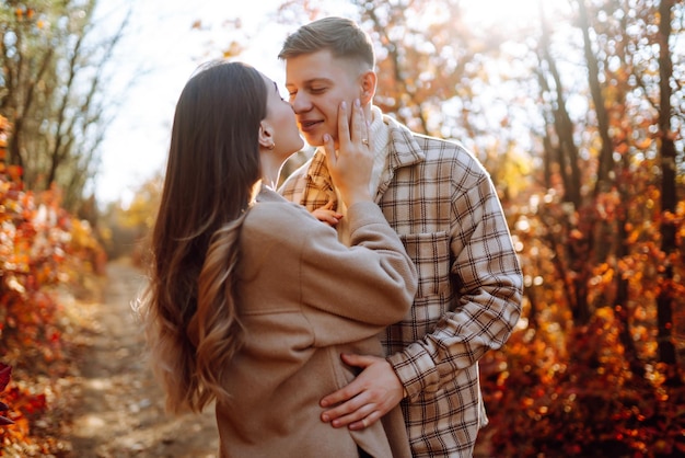 Stylish couple walking and enjoying autumn weather People relaxation and vacations concept