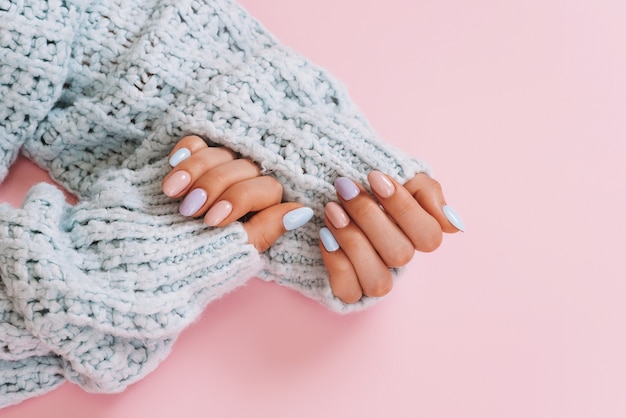 Stylish fashionable female manicure Beautiful hands of a young woman