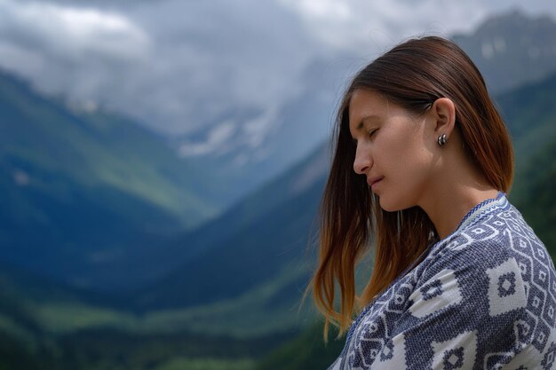 Stylish female hipster walking on top of mountains