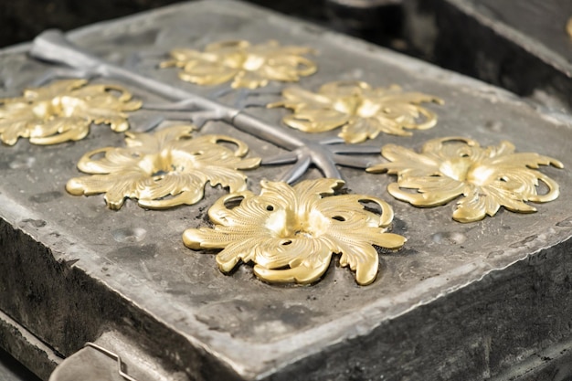 Stylish golden flower and grey branches molded in high precision cast in traditional production plan...