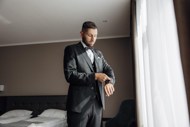 Stylish groom portrait getting ready in the morning for wedding ceremony Morning