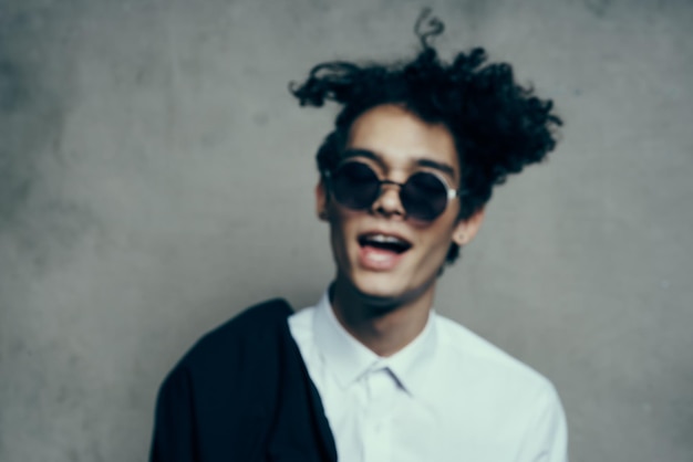 Stylish guy with curly hair emotions wide open mouth portrait model High quality photo