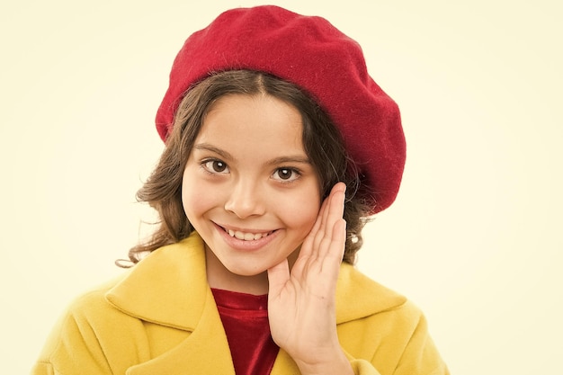 Stylish headdress childhood happiness beauty and spring fashion small parisian girl with happy face in headdress little girl child in french beret headdress childrens day France autumn style