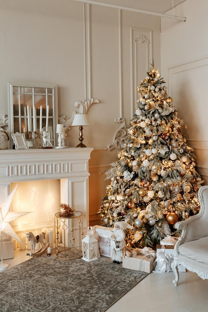 Stylish interior of a bright living room with a decorated Christmas tree