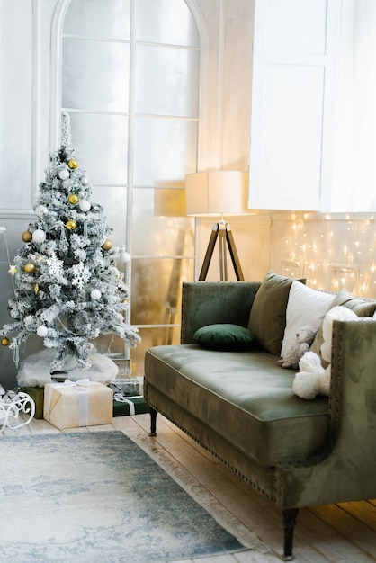 Stylish interior of living room with decorated Christmas tree