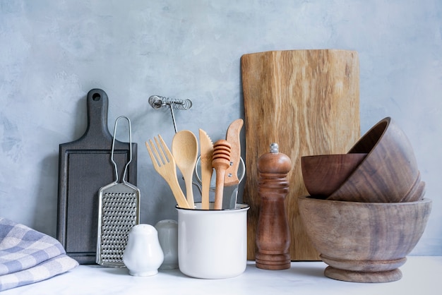 Stylish kitchen background with kitchen utensils on marble countertop