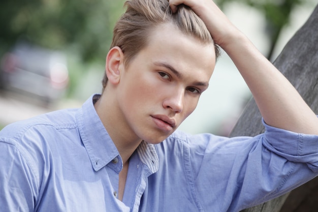 Stylish man portrait in a park.