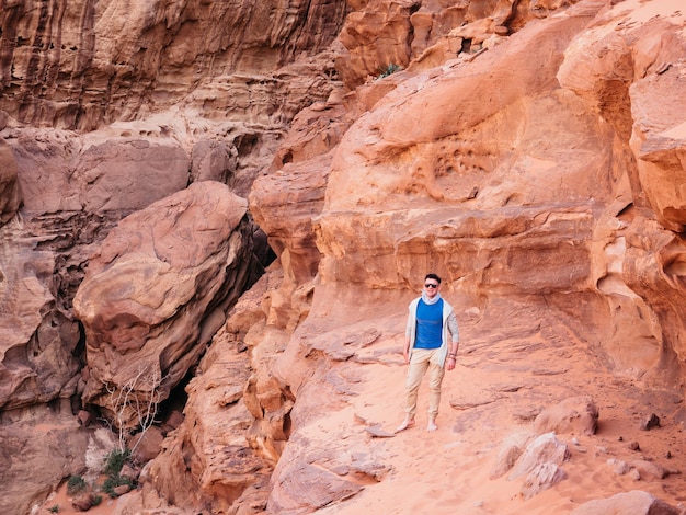 Stylish man and the sights of the Wadi Rum