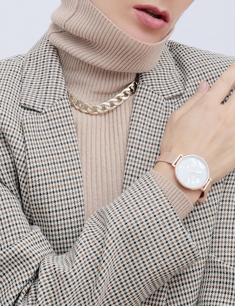 Stylish paris Lady Details of everyday look Casual beige checkered jacket and accessories watch and chain Trendy Minimalistic style Fashion fall winter spring look book