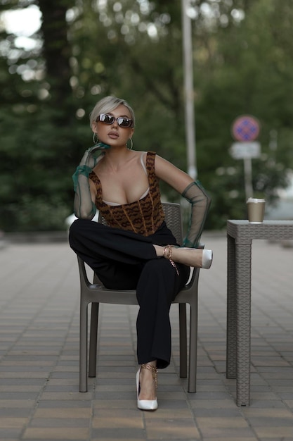 Stylish portrait of a girl in glasses and gloves