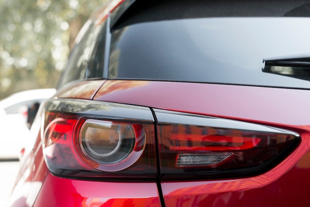 Stylish rear light on new red automobile