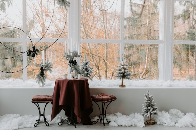 Stylish room interior with beautiful Christmas tree and decorative fireplace