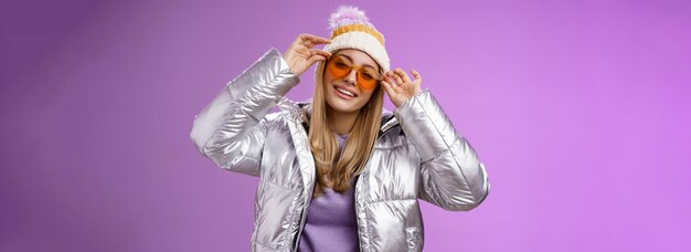 Stylish sassy daring blond european girl acting cool wear stylish sunglasses silver jacket winter