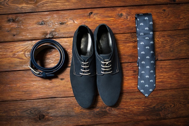 Stylish set of male shoes belt and printed tie. Trendy look