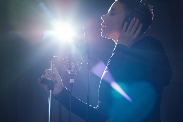 Stylish singer in recording studio